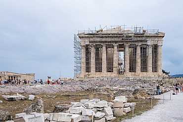 Detail of the Parthenon, a former temple dedicated to the goddess Athena, located on the Acropolis of Athens. The Acropolis is an ancient citadel situated on a rocky outcrop above the city of Athens, Greece.