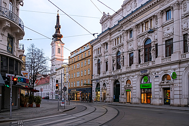 Vienna, Austria – View of the Theater Odeon's neo-Baroque facade on Taborstraße, featuring symmetrical arched windows, ornate stucco decorations, and a grand central entrance marking this early 20th-century cultural venue.
