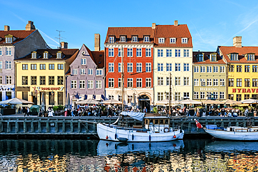 Copenhagen, Denmark – View of Nyhavn (New Haven), a 17th-century waterfront and canal lined with colorful historic townhouses, cafes, and wooden ships.