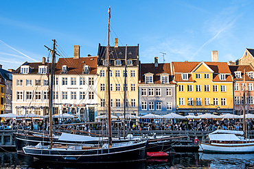 Copenhagen, Denmark – View of Nyhavn (New Haven), a 17th-century waterfront and canal lined with colorful historic townhouses, cafes, and wooden ships.