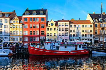 Copenhagen, Denmark – View of Nyhavn (New Haven), a 17th-century waterfront and canal lined with colorful historic townhouses, cafes, and wooden ships.