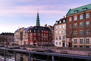 Copenhagen, Denmark – View of Ved Stranden, a historic waterfront street lined with colorful 18th-century buildings, offering picturesque scenes along the canal near Christiansborg Palace.