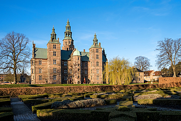Copenhagen, Denmark – View of Rosenborg Slot from Kongens Have, showing the castle framed by tree-lined paths and floral gardens, highlighting its regal presence in Copenhagen’s oldest royal park.