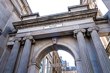 Glasgow, Scotland – Architectural detail of the grand arch at Royal Exchange Square, showcasing ornate Victorian stonework and historic 19th-century civic design.