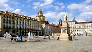 View of Piazza Castello, a prominent city square housing several landmarks, museums, theaters and cafes with the monument to the Standard Bearer of the Sardinian Army in the foreground, Turin, Piedmont, Italy, Europe