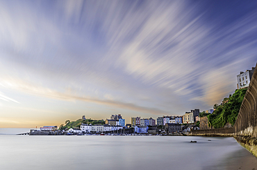 Sunrise over Tenby's harbour on a calm summer morning, a holiday destination on the south coast of Wales, Tenby, Pembrokeshire, Wales, United Kingdom, Europe