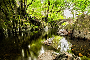 Overcast day in the Eskdale Valley with calm and cold waters from Trough House Bridge and the stunning River Esk, Lake District National Park, UNESCO World Heritage Site, Cumbria, England, United Kingdom, Europe