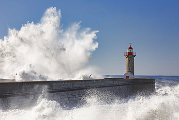 Strong storm over the ocean, Lighthouse in Porto. Portugal, Europe