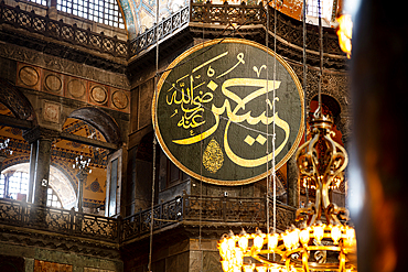 Hagia Sophia Mosque interior, left side wall with view of a panel with an inscription from the Holy Quran, UNESCO World Heritage Site, Istanbul, Turkey, Europe