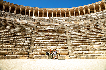 Resting couple, view from a middle of an ancient Amphitheatre, Aspendos, Antalya Province, Turkey, Asia Minor, Eurasia