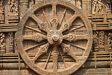 Konark 13th-century Sun Temple (Surya Deula) designed to represent chariot of Hindu Sun God with 12 huge carved stone wheels and 7 stone horses around its base UNESCO World heritage site.Images of stone chariot wheels.