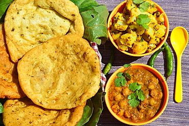 Chole Bhature/Kulcha food dish popular in northern areas of India It is a combination of channa (spicy white chickpeas) fried potato and bhatura/Kulcha,a deep-fried bread made from maida