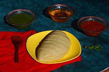 Siddu, a special traditional dish of Himachal Pradesh, a steamed wheat flour bread stuffed with split black lentils and dry fruits, served with desi ghee, tomato and green mint chutney, Himachal Pradesh, India, Asia