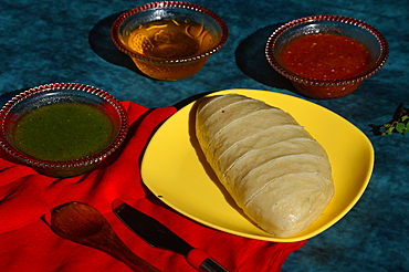 Siddu, a special traditional dish of Himachal Pradesh, a steamed wheat flour bread stuffed with split black lentils and dry fruits, served with desi ghee, tomato and green mint chutney, Himachal Pradesh, India, Asia