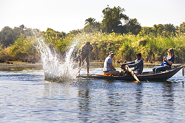 Tourists in the company of net fishermen in rowing boat, village of Ramadi, west bank of the Nile south of Edfu, Egypt, North Africa, Africa