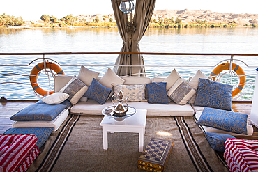 Lounge on the deck of a Dahabeah,passenger river boat of the Lazuli fleet, sailing on the Nile river, Egypt, northeast Africa