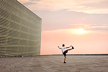 Man practising Tai-Chi on esplanade of Kursaal Congress Centre and Auditorium by Spanish architect Rafael Moneo, San Sebastian, Bay of Biscay, province of Gipuzkoa, Basque Country, Spain, Europe