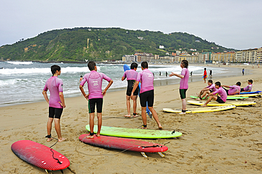 Surf class on Zurriola beach, district of Gros, San Sebastian, Bay of Biscay, province of Gipuzkoa, Basque Country, Spain, Europe