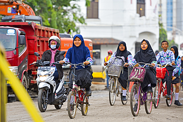 high school girls on a bike, Old Town of Semarang, Java island, Indonesia, Southeast Asia