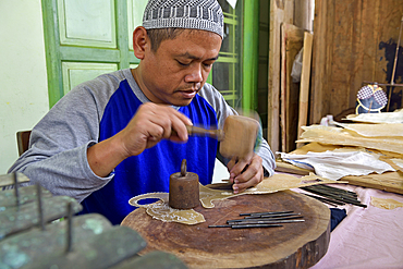 workshop of puppets for shadow play (wayang kulit), Bima Art Shadow Puppet Maker, Sondakan district, Solo (Surakarta), Java island, Indonesia, Southeast Asia