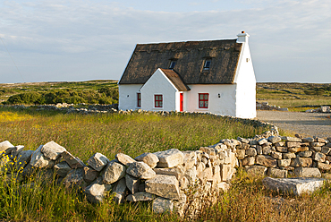 cottage and low wall,Connemara,County Galway,Ireland,Western Europe