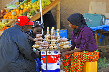 Street vendor of grilled peanuts, Dakar, Senegal, West Africa