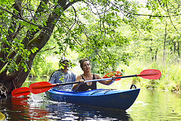 Canoe trip on a branch of the river connecting the lakes Almajas and Asekas around Ginuciai, Aukstaitija National Park, Lithuania, Europe