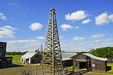 The Spindletop-Gladys City Boomtown Museum that features an oil derrick and many reconstructed Gladys City building interiors furnished with authentic artifacts from the Spindletop boomtown period, Beaumont, Texas, United States of America, North America