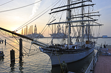 tall ship Elissa (1877), a three-masted barque moored in the port of Galveston at sunset, Galveston island, Gulf of Mexico, Texas, United States of America, North America