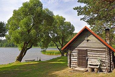 Traditional sauna on the edge of Lusiai Lake at Paluse, Aukstaitija National Park, Lithuania, Europe