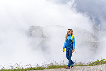 hiker in the mist near the refuge Lavaredo, Three Peaks nature park, Trentino-Alto Adige, Sudtyrol, South Tyrol, Italy, South-central Europe