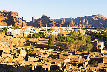 Old mudbrick village under reconstruction with new neighborhoods in the background, in the Old town of AlUla, Medina Province, Saudi Arabia, Middle East