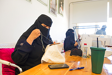 Madrasat Adeera, originaly a Girl's School, now an artistic space where women learn and practice different crafts, here a sewing and embroidery workshop, whose creations will be sold in the old town of AlUla, Medina Province, Saudi Arabia, Middle East