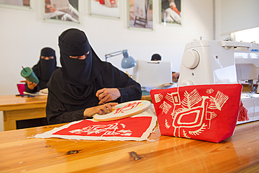 Madrasat Adeera, originaly a Girl's School, now an artistic space where women learn and practice different crafts, here a sewing and embroidery workshop, whose creations will be sold in the old town of AlUla, Medina Province, Saudi Arabia, Middle East