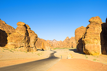 Road trough the sandstone rock formations in the desert canyons of the Ashar Valley, Medina Province, Saudi Arabia, Middle East