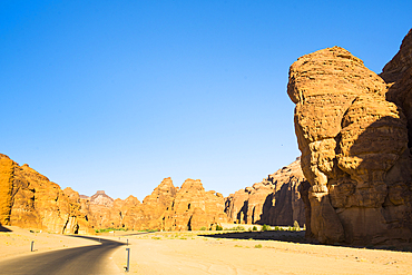 Road trough the sandstone rock formations in the desert canyons of the Ashar Valley, Medina Province, Saudi Arabia, Middle East