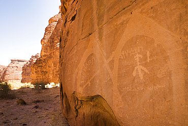 Ancient symbols and rock carvings on a sandstone rock cliff in the Sharaan Nature Reserve, AlUla, Medina Province, Saudi Arabia, Middle East