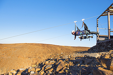 AlUla Zipline, starting from Harrat volcanic plateau, racing 1,5km at up to 120km/h speed, enjoying the incredible scenery of the Mountains, Medina Province, Saudi Arabia, Middle East