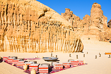 Relaxing place beside the Swimming pool, surrended by magnificent sandstone rock structures, of Our Habitas AlUla, a sustainable desert luxury resort nestled within an ancient oasis in the desert canyons of the Ashar Valley, Medina Province, Saudi Arabia,