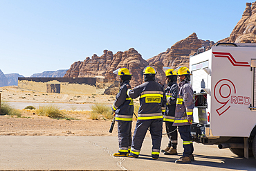 FireFighter team ready to intervene at the landing of a helicopter near the Maraya Theatre, in AlUla's Ashar Valley, Medina Province, Saudi Arabia, Middle East