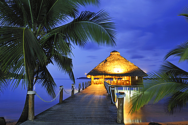 Bar and restaurant on stilts at dusk, Playa Tortuga hotel, Colon Island, Bocas del Toro Archipelago, Republic of Panama, Central America