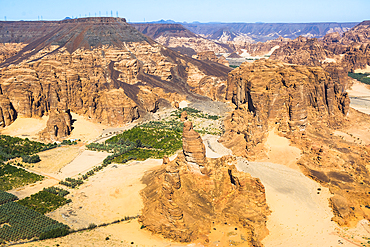 Aerial view of Palm grove and farms in AlUla's Ashar Valley, Medina Province, Saudi Arabia, Middle East