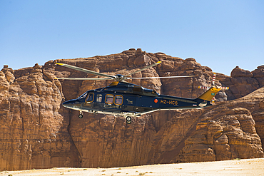 Helicopter approaching the landing area near the Maraya Theatre, in AlUla's Ashar Valley, Medina Province, Saudi Arabia, Middle East