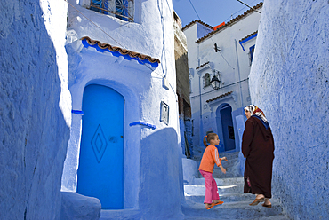 Woman and kid in the medina of Chefchaouen,Rif region,Morocco,North Africa