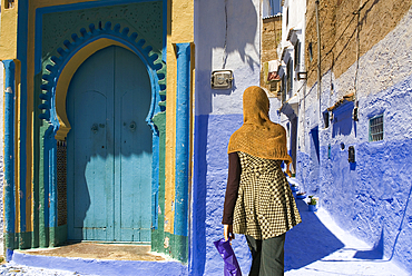 Blue door and alley in the medina of Chefchaouen,Rif region,Morocco,North Africa