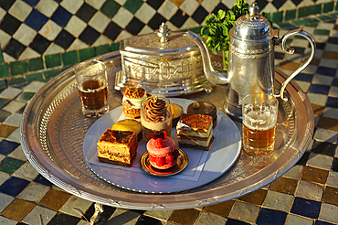Pastries designed by Pierre Herme, made by Richard Bourlon, with mint tea, Pavillion Menzeh, garden of La Mamounia Hotel, Marrakesh, Morocco