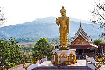 Gilded Buddha's statue at Wat Phu That temple, Udomxay, Oudomxay Province in northwestern Laos, Southeast Asia