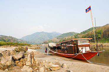 Cruise boat, owned by ' The Luang Say Lodge & Cruises', moored on the bank of Mekong River in front of the Luang Say Lodge at Pakbeng, Oudomxay Province, Laos, Southeast Asia