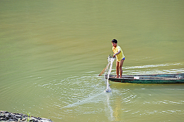 Fisherman with dugout canoe on the Mekong River, Pakbeng, Oudomxay Province, Laos, Southeast Asia