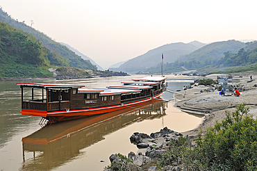 Cruise boat, owned by ' The Luang Say Lodge & Cruises', moored on the bank of Mekong River in front of the Luang Say Lodge at Pakbeng, Oudomxay Province, Laos, Southeast Asia